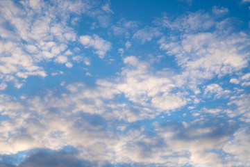 Blue sky with clouds on a bright sunny day