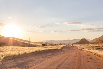 Sunset drive through desert landscape