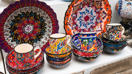  Decorative enamelled plates on sale at a local street bazaar, Mostar, Bosnia and Herzegovina -...