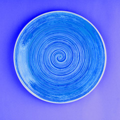 Blue plate on the dark blue background