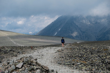 Woman hiking Besseggen Trail in Jotunheimen National Park