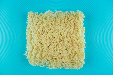 Noodle in big Glass bowl Underwater with blue backgroung