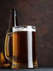 Close-up of a cold beer mug on a dark background