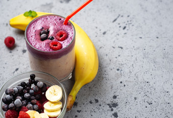 double layer smoothie with berries and banana. blueberries and raspberries