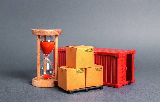 Red container with cardboard boxes and an hourglass. Express delivery in short time concept. Temporary storage, limited offer and discount. Optimization of delivery logistics Transport company