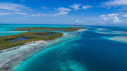 Naklejka premium Caribbean: Vacation in the blue sea and deserted islands. Aerial view of a blue sea with crystal water. Great landscape. Beach scene. Aerial View Island Landscape Los Roques