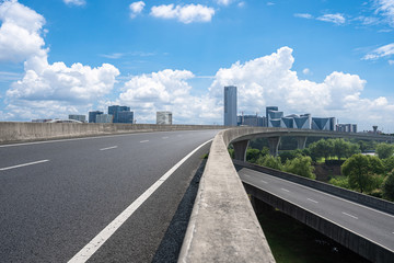 city skyline with empty road