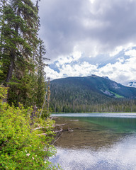 View at Mountain Lake with Dramatic Clouds in British Columbia, Canada.