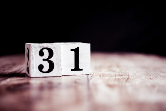 Number 31 isolated on dark background- 3D number thirty one isolated on vintage wooden table