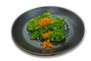 Seaweed and chopsticks in white background, focus selective.