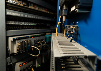 Low light view of Main line connection point to the circuit board. And electrode system inside the control cabinet.