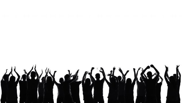 Silhouettes of fans in a crowd on a white background in studio