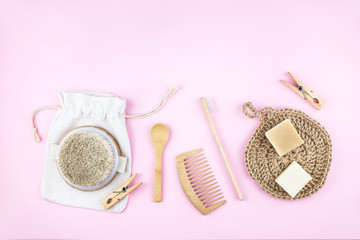 Zero waste set for bathing on light pink background.