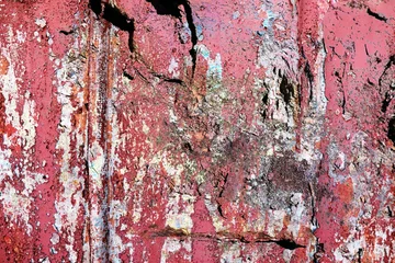 Detailed close up view of aged and weathered concrete walls with cracks and paint in high resolution © Michael