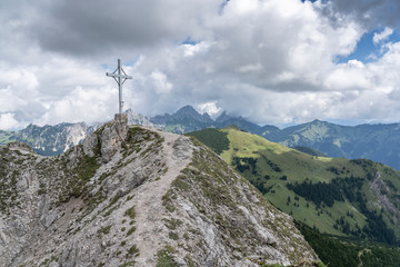 Fototapeta premium approaching the summit of Litnis Schrofen during a bike and hike adventure in the Tannheim Valley, Tirol Austria