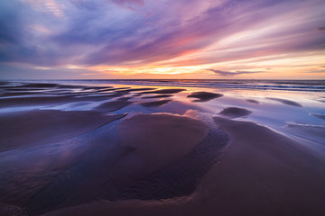 Fototapeta na wymiar Beautiful golden sunset over the beach.