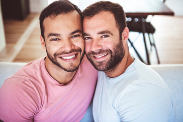 Fototapeta premium Portrait of a Cute Male gay homosexual Couple at Home