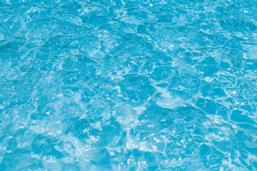 Fototapeta na wymiar Beautiful ripple wave and blue water surface in swimming pool, Blue sea background and abstract
