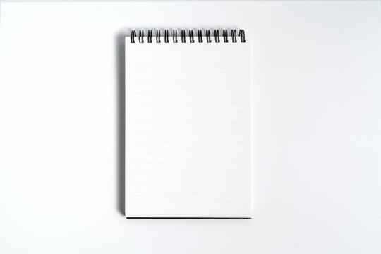 Notebook mock up with clean black blank for design and advertising. Notepad with chromed spring and free copy space template. On the gray background.