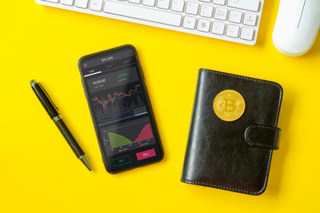 Bitcoin BTC stock exchange trading background concept. Analyzing stock market investments with financial dashboard, business intelligence graph on smartphone screen, top view