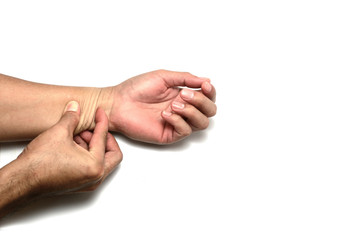 Skin elasticity check. the right hand  push the skin on the back of left  arm  on white background isolated