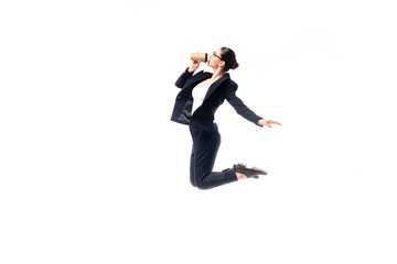 young businesswoman drinking coffee to go while dancing isolated on white