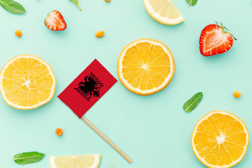 Albania Paper Stick Flag. National summer fruits concept, local food market. Vegetarian theme.