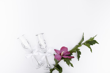Top view wedding glasses with a flower