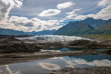 Obraz na płótnie Canvas A summer reflection on an Alaskan glacier