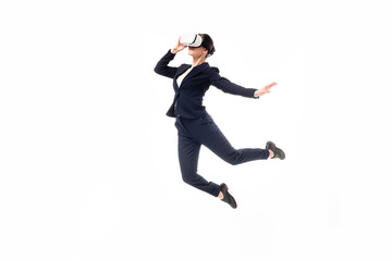 Fototapeta na wymiar businesswoman in virtual reality headset levitating isolated on white