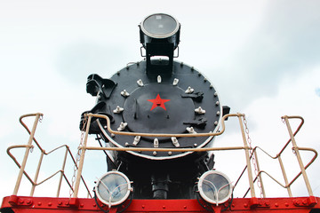 Train close up. Part of an old train against the sky