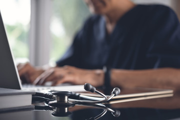 Doctor working on laptop computer