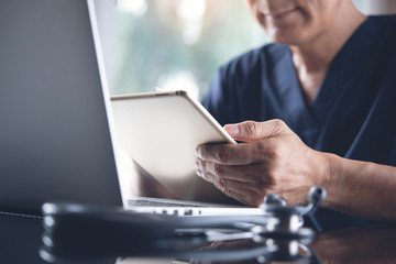 Doctor working on laptop computer