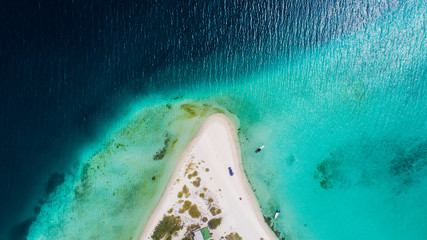 Caribbean: Vacation in the blue sea and deserted islands. Aerial view of a blue sea with crystal water. Great landscape. Beach scene. Aerial View Island Landscape Los Roques