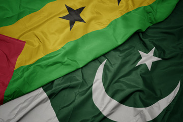 waving colorful flag of pakistan and national flag of sao tome and principe ,.