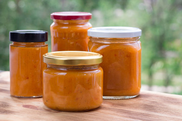 Summer composition of apricot jam cans prepared from fruit harvest