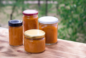 Composition of apricot jam cans cooked from berry harvest