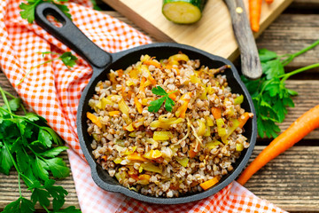 Boiled and fried buckwheat with carrots and zucchini