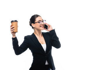 happy businesswoman talking on smartphone while holding coffee to go isolated on white