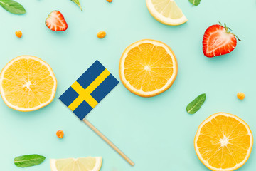 Sweden Paper Stick Flag. National summer fruits concept, local food market. Vegetarian theme.