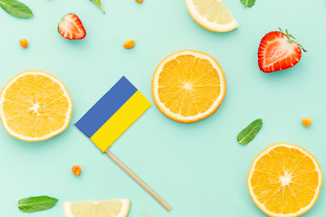 Ukraine Paper Stick Flag. National summer fruits concept, local food market. Vegetarian theme.