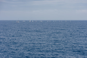 Splendid panoramic view of the crystal blue sea of the island of Elba in Italy with boats on the horizon