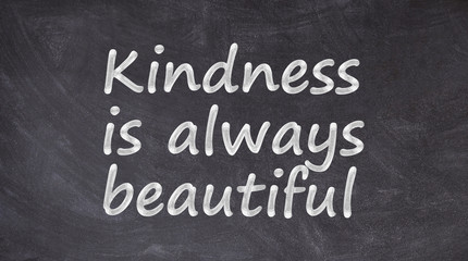 Kindness is always beautiful written on blackboard
