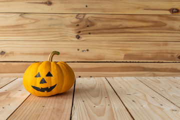 Front view of Halloween pumpkins, Yellow pumpkins ghost on wooden background., Halloween concept.