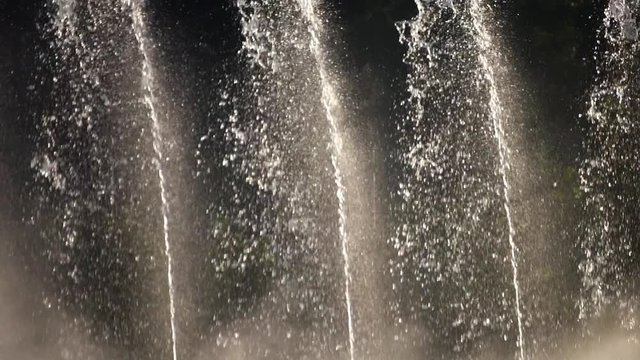 Detail slow motion of artesian fountain in the park