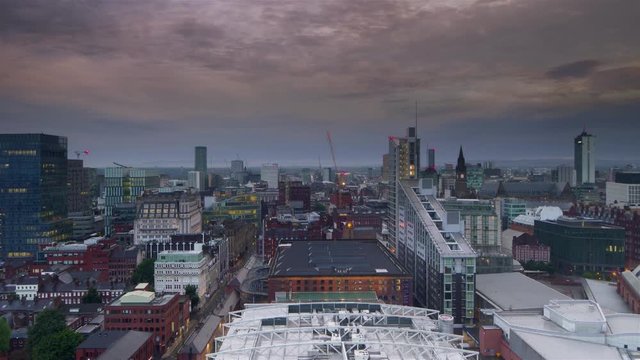 manchester city skyline timelapse from night to day aerial view england uk