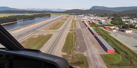 aerial view of the juneau alaska airport from a helicopter showing the runways and seaplane landing inlet