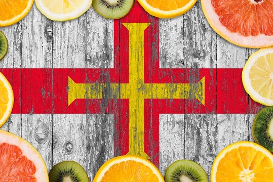 Guernsey Food Concept. Fresh Fruits From Traditional Gardens. Cooking Concept On Wooden Flag Background.