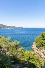 Fotobehang Splendid panoramic view of the crystal blue sea of the island of Elba in Italy  © Filippo Corti