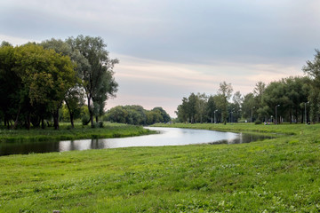 Beautiful sky on the Insar. Forest river landscape. River forest view. Forest river summer scene. Forest river water